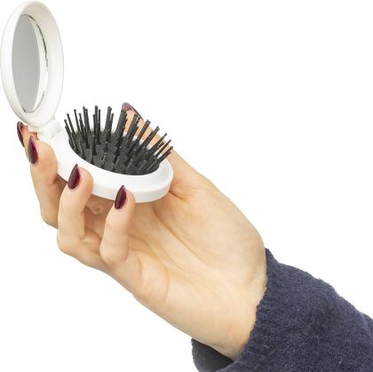 The Eloi - Brush and mirror in a recycled case